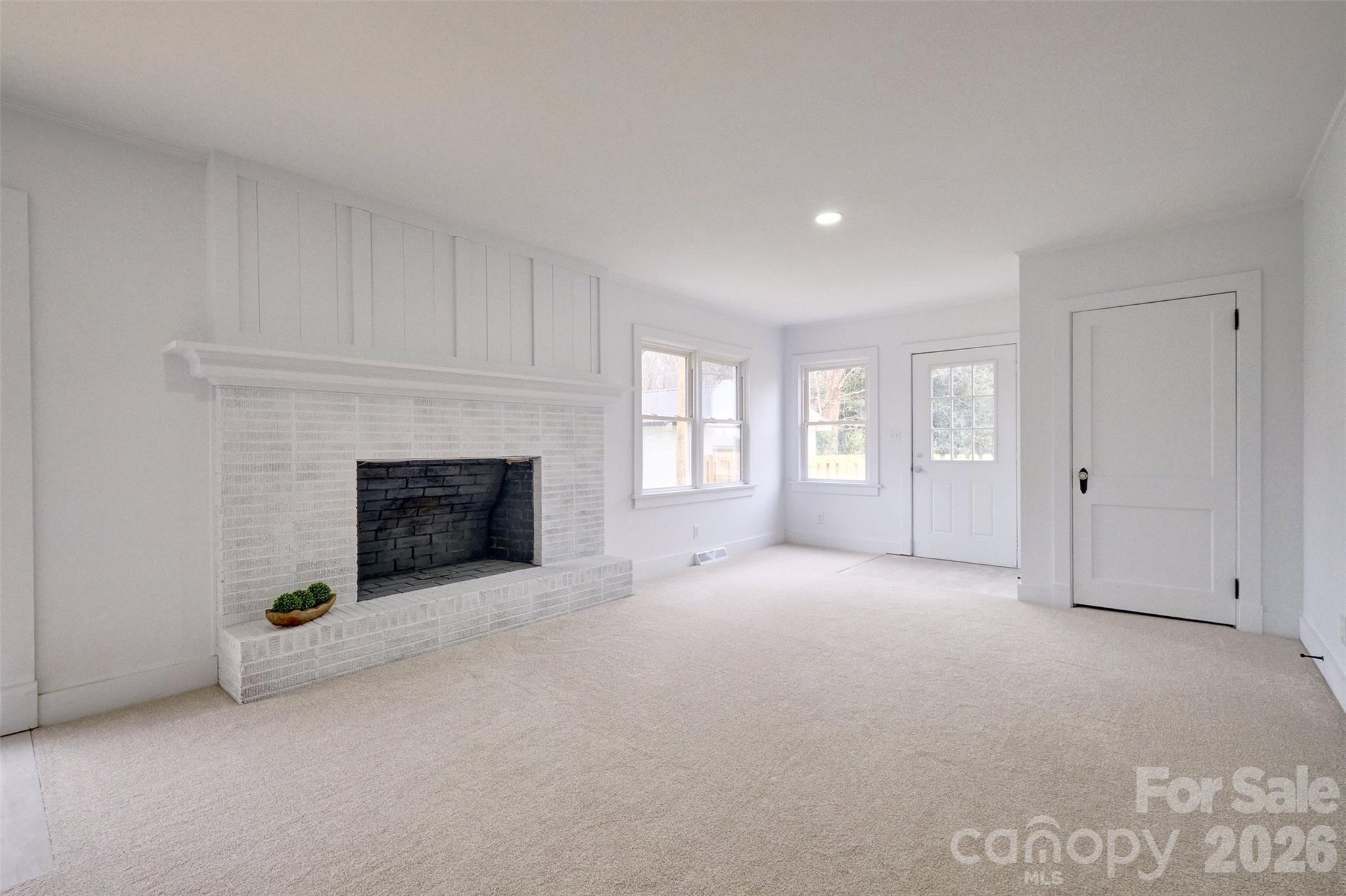 804 Congress Street North York, SC 29745 - Photo 13 of 48 a view of an empty room with a fireplace and a window