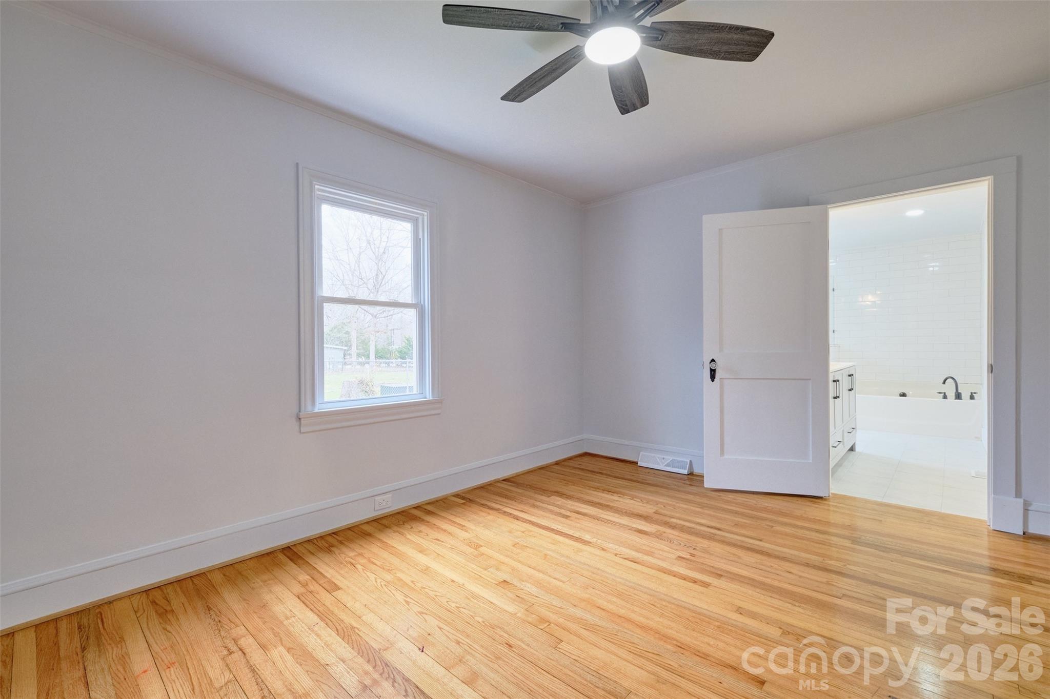 804 Congress Street North York, SC 29745 - Photo 19 of 48 a view of empty room with wooden floor and fan