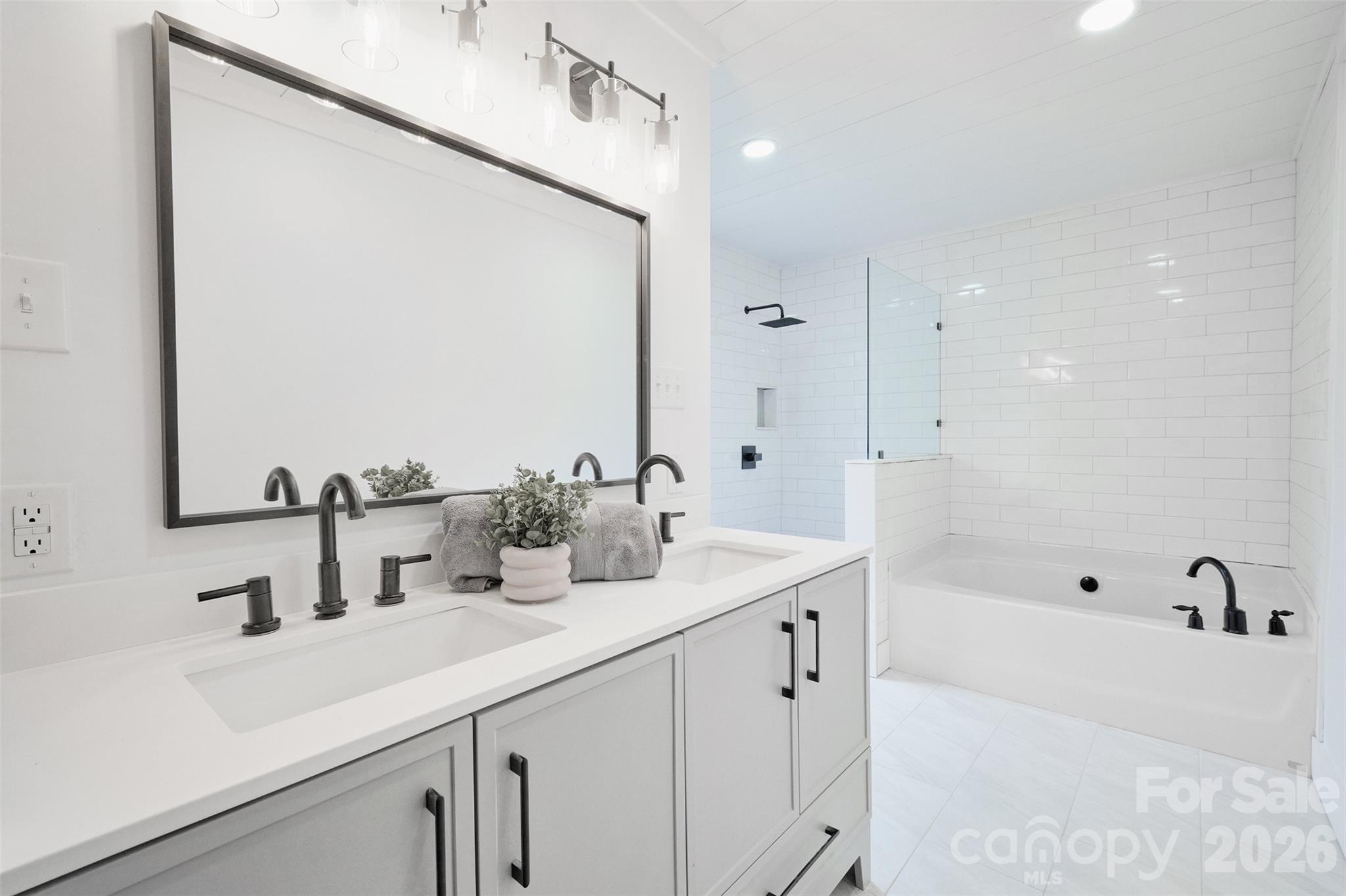 804 Congress Street North York, SC 29745 - Photo 21 of 48 a bathroom with 2 sink and a bathtub
