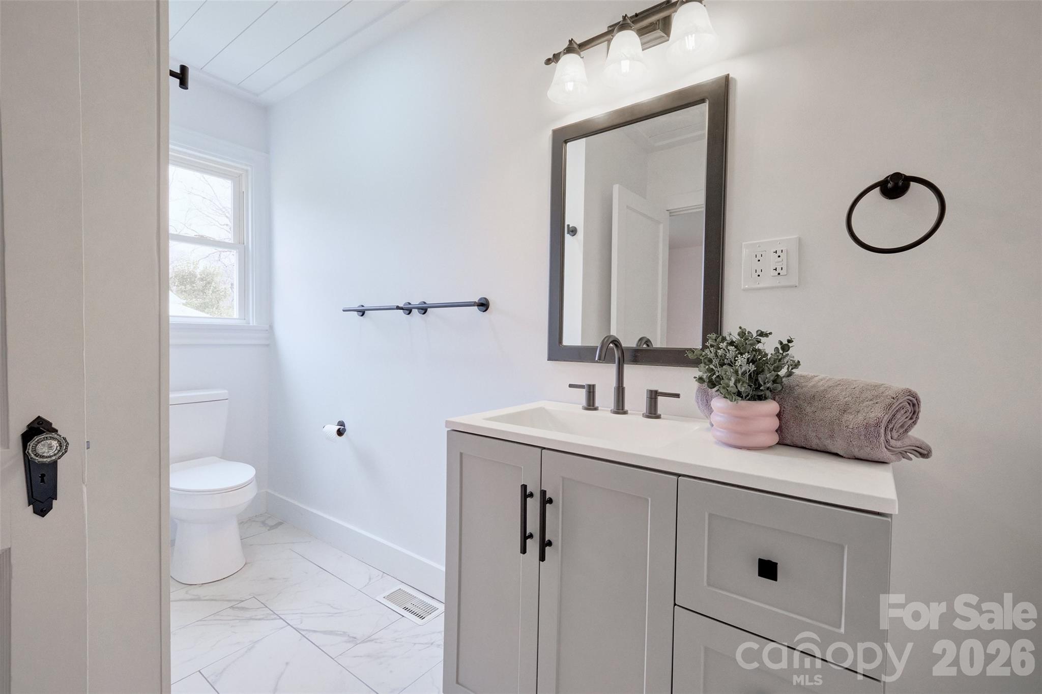 804 Congress Street North York, SC 29745 - Photo 24 of 48 a bathroom with a double vanity sink toilet and mirror
