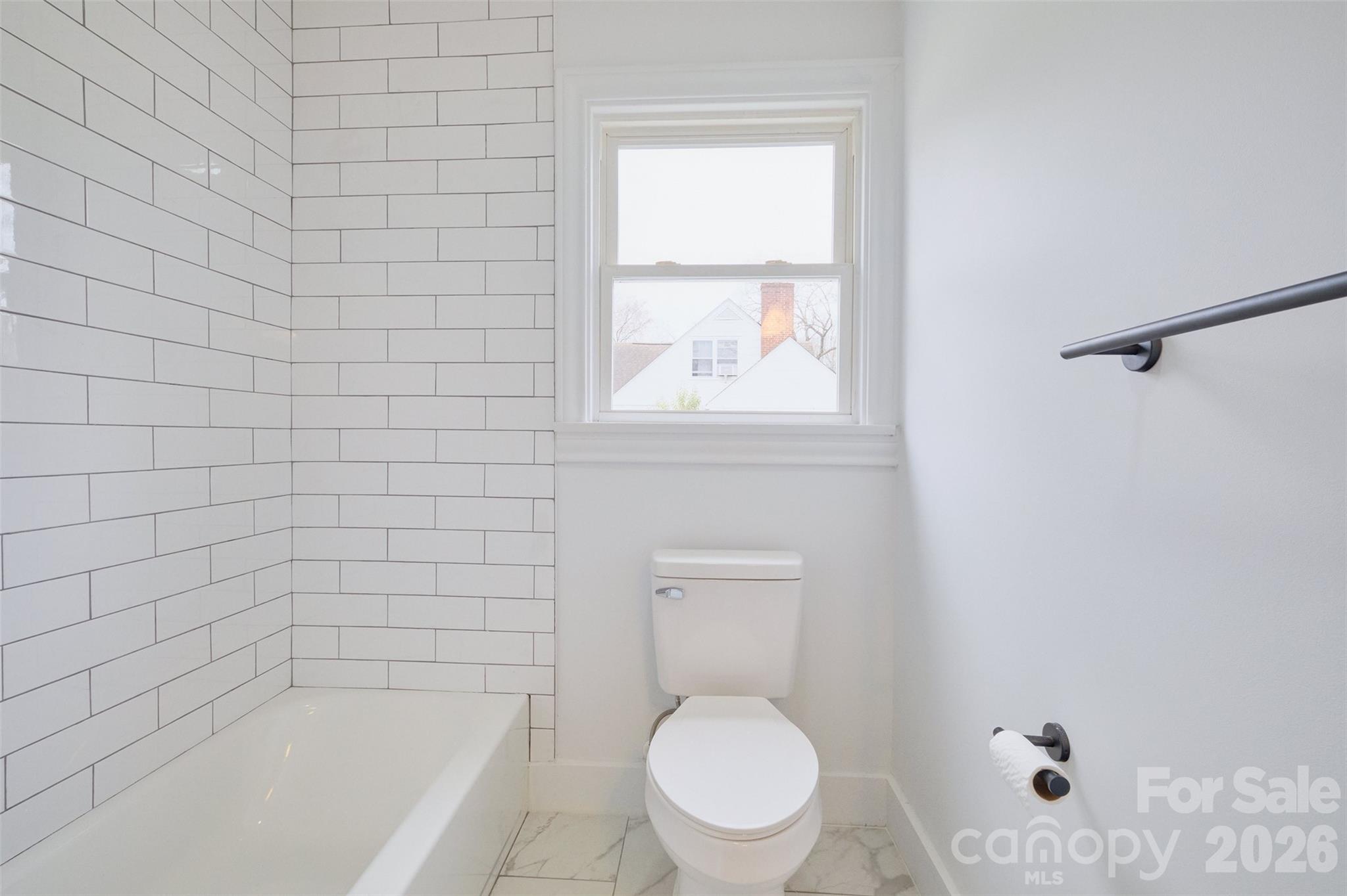 804 Congress Street North York, SC 29745 - Photo 25 of 48 a white toilet sitting next to a bath tub