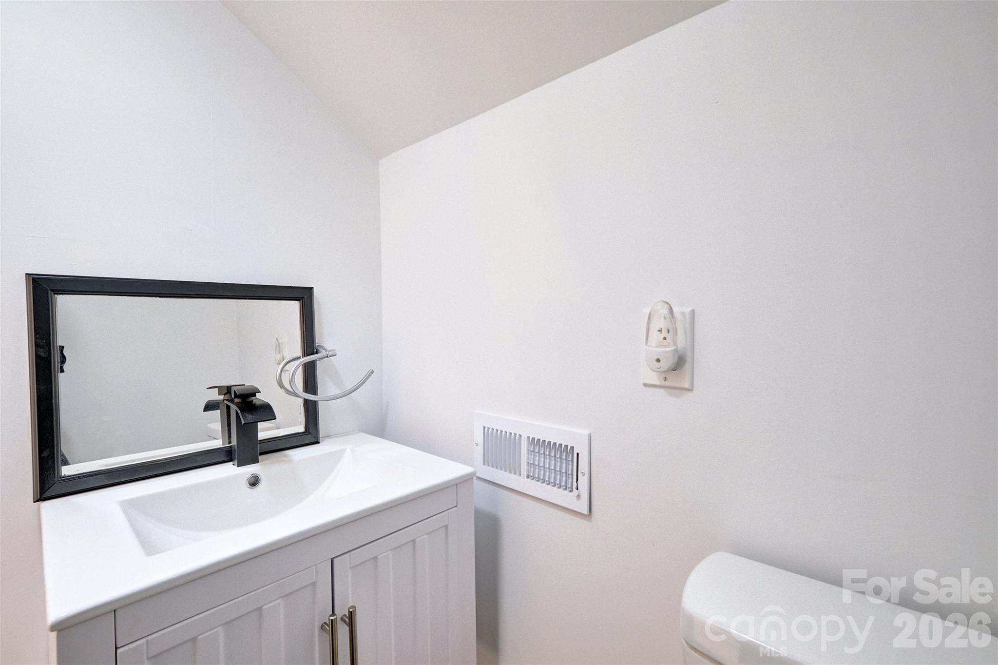 804 Congress Street North York, SC 29745 - Photo 34 of 48 a bathroom with a sink and a mirror