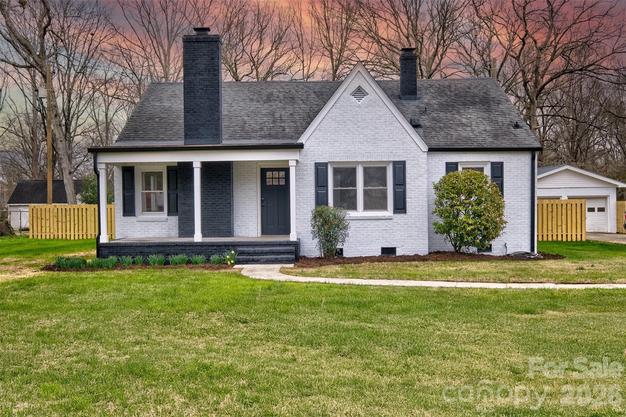 804 Congress Street North York, SC 29745 - Photo 44 of 48 a front view of a house with a garden