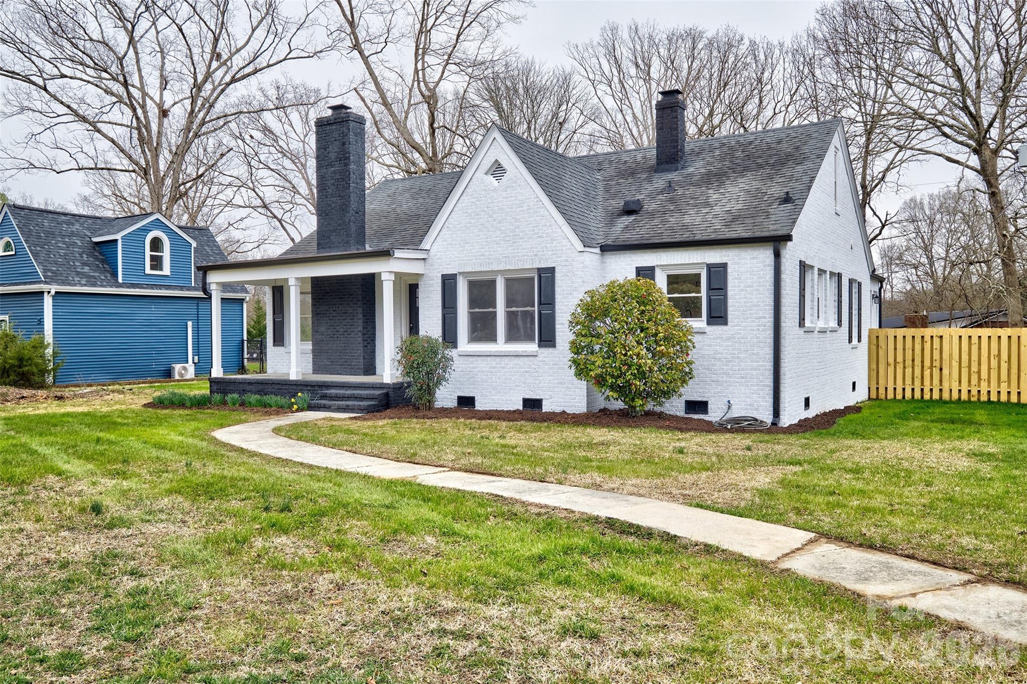 804 Congress Street North York, SC 29745 - Photo 45 of 48 a front view of a house with a garden and yard