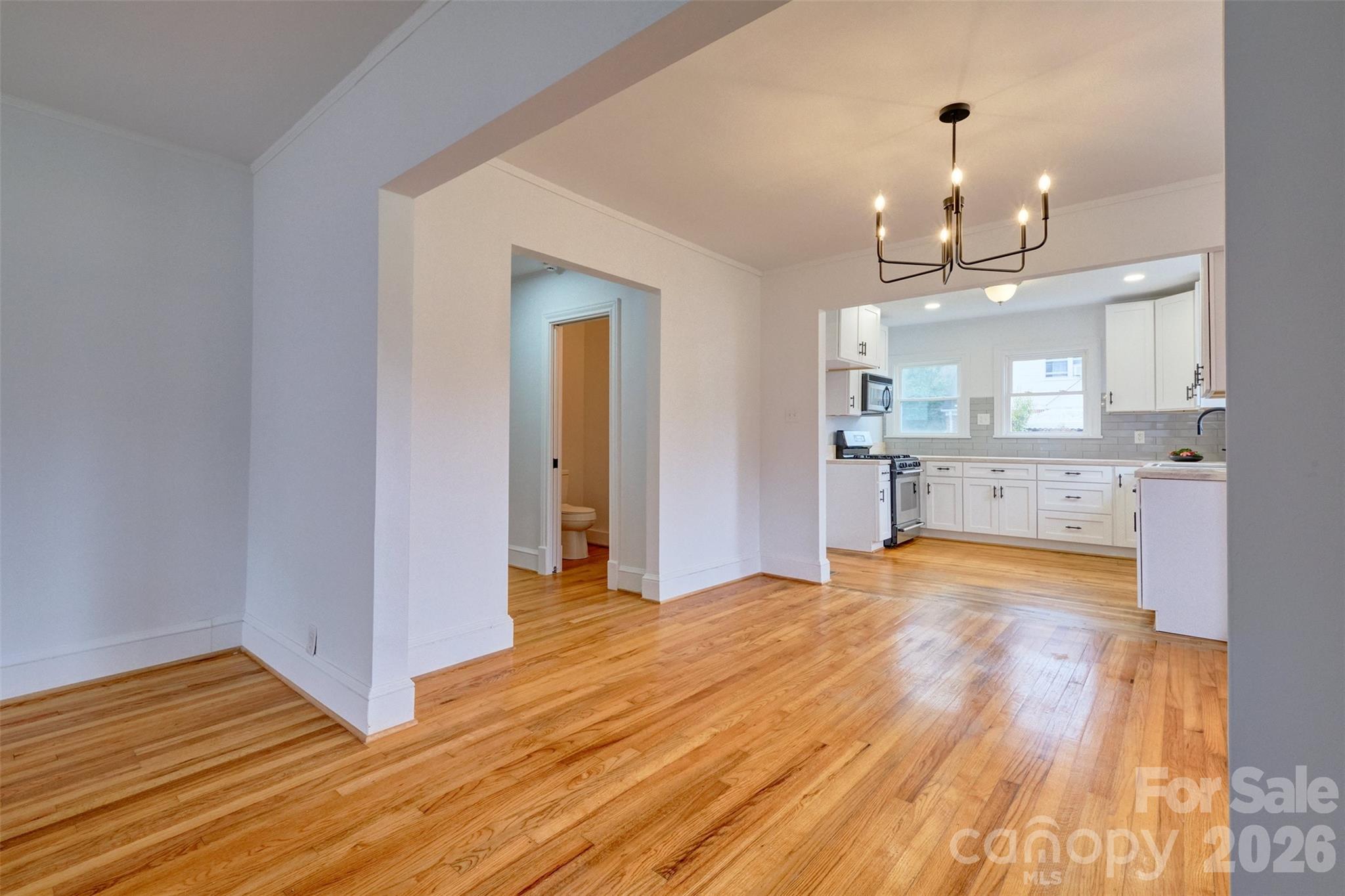 804 Congress Street North York, SC 29745 - Photo 6 of 48 a view of a kitchen with wooden floor and a kitchen