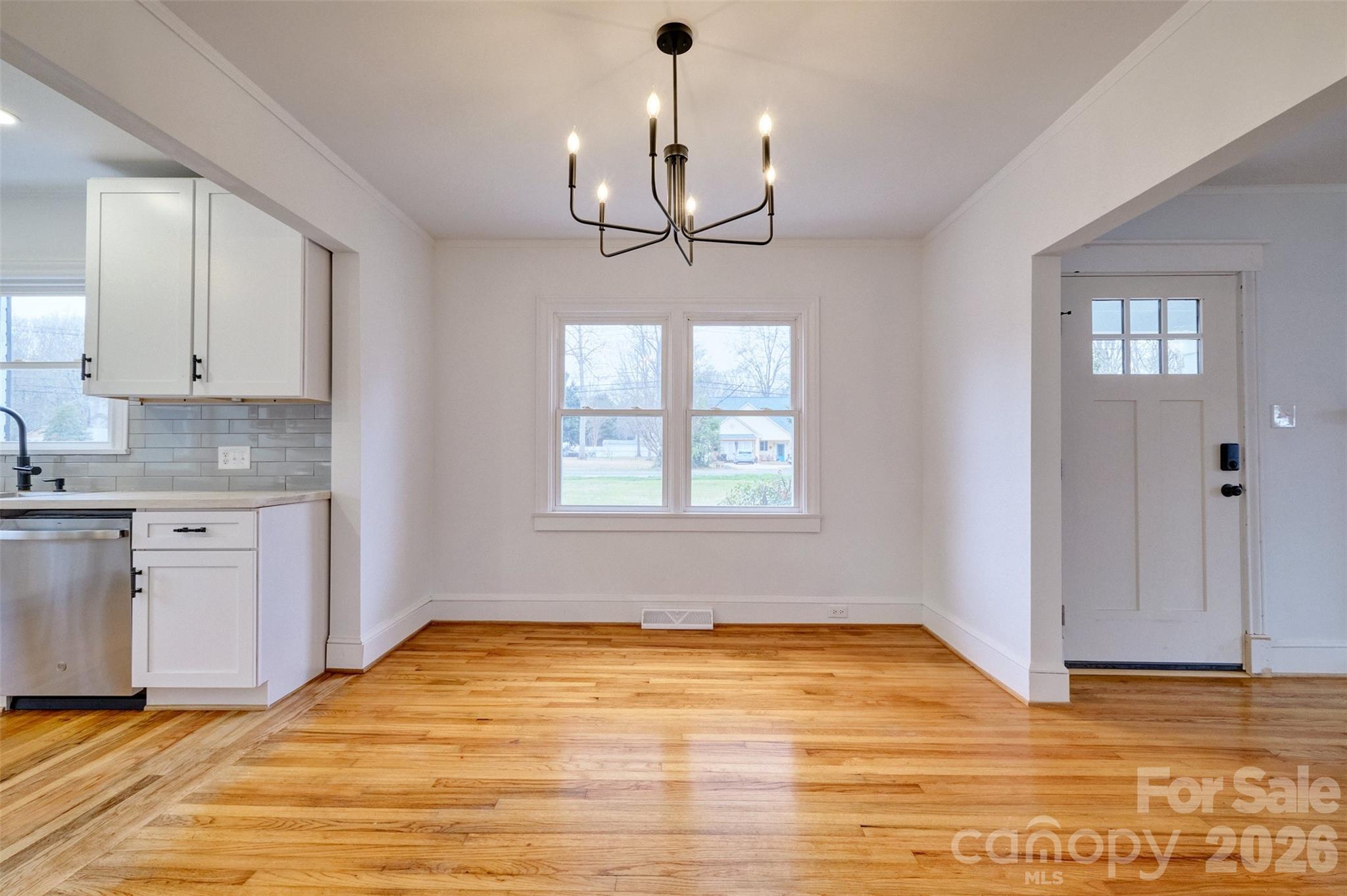 804 Congress Street North York, SC 29745 - Photo 7 of 48 a view of empty room with kitchen and window