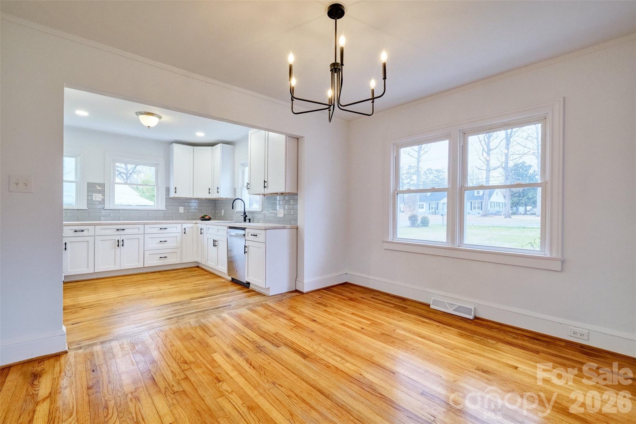 804 Congress Street North York, SC 29745 - Photo 8 of 48 a view of a kitchen with a sink wooden floor and a window