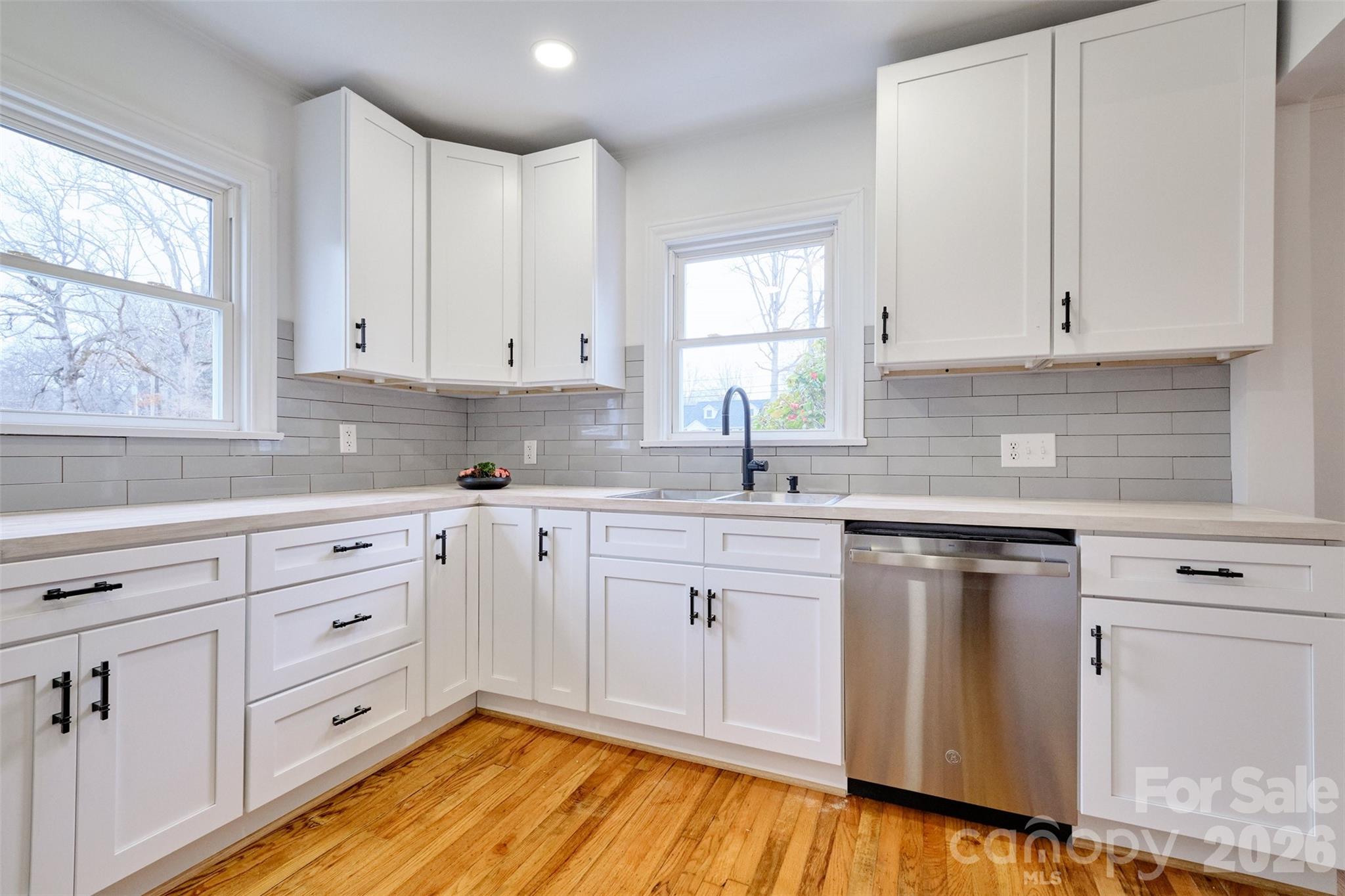804 Congress Street North York, SC 29745 - Photo 10 of 48 a kitchen with cabinets appliances a sink and a window