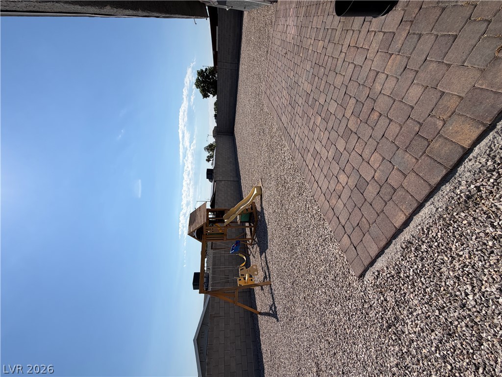 2820 South Sandhill Road, Unit A Las Vegas, NV 89121 - Photo 25 of 26 An inviting backyard oasis offers a dedicated play area, perfect for family enjoyment.