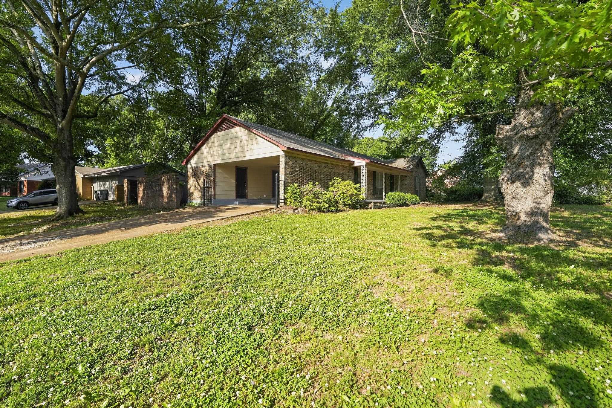 2015 East Holmes Road Memphis, TN 38116 - Photo 11 of 34 a view of a house with a yard