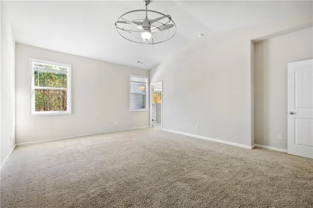 an empty room with a empty space and a window