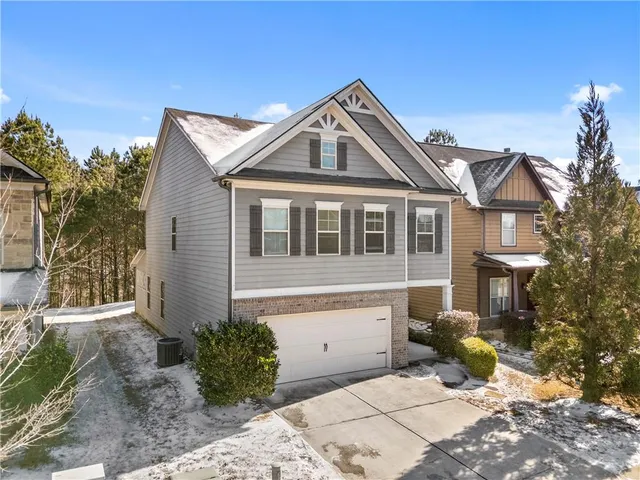 a front view of a house with yard