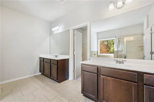 a room with a sink and a mirror