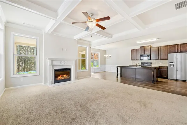 a view of a kitchen with microwave and a stove top oven
