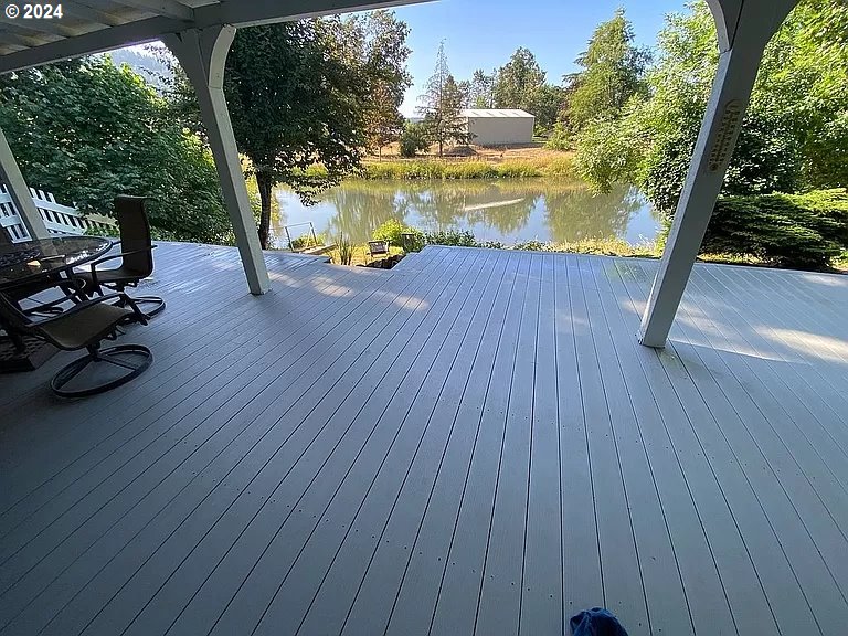 34036 Row River Road Cottage Grove, OR 97424 - Photo 1 of 15 a view of a swimming pool with a patio