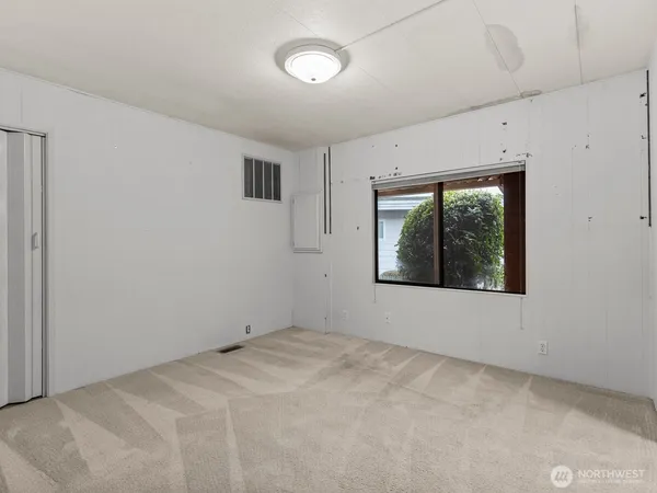 a bathroom with a toilet a sink and a mirror