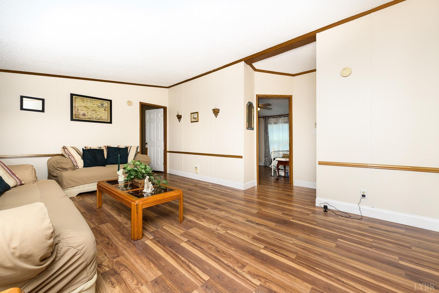 461 Byrd Mill Road Louisa, VA 23093 - Photo 32 of 81 a living room with furniture and wooden floor