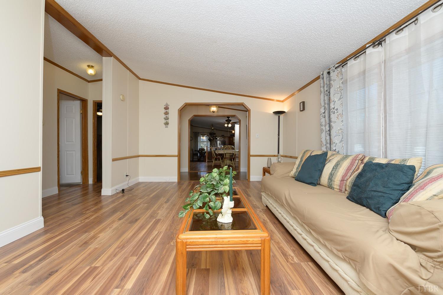 461 Byrd Mill Road Louisa, VA 23093 - Photo 37 of 81 a living room with furniture and a wooden floor