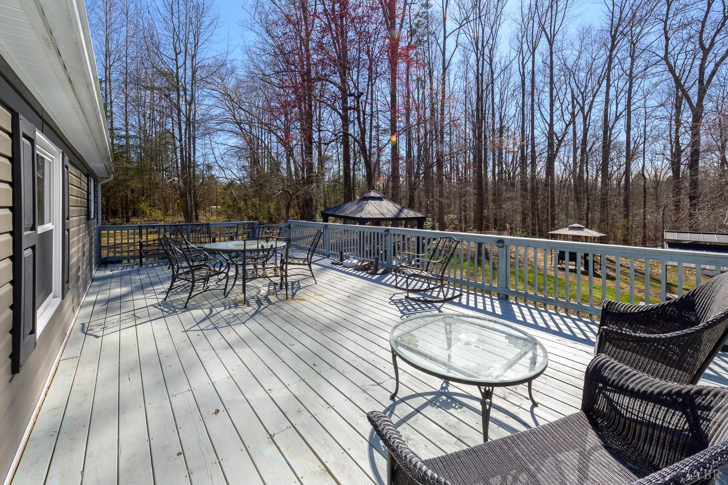 461 Byrd Mill Road Louisa, VA 23093 - Photo 58 of 81 a view of a chairs and table on the wooden floor