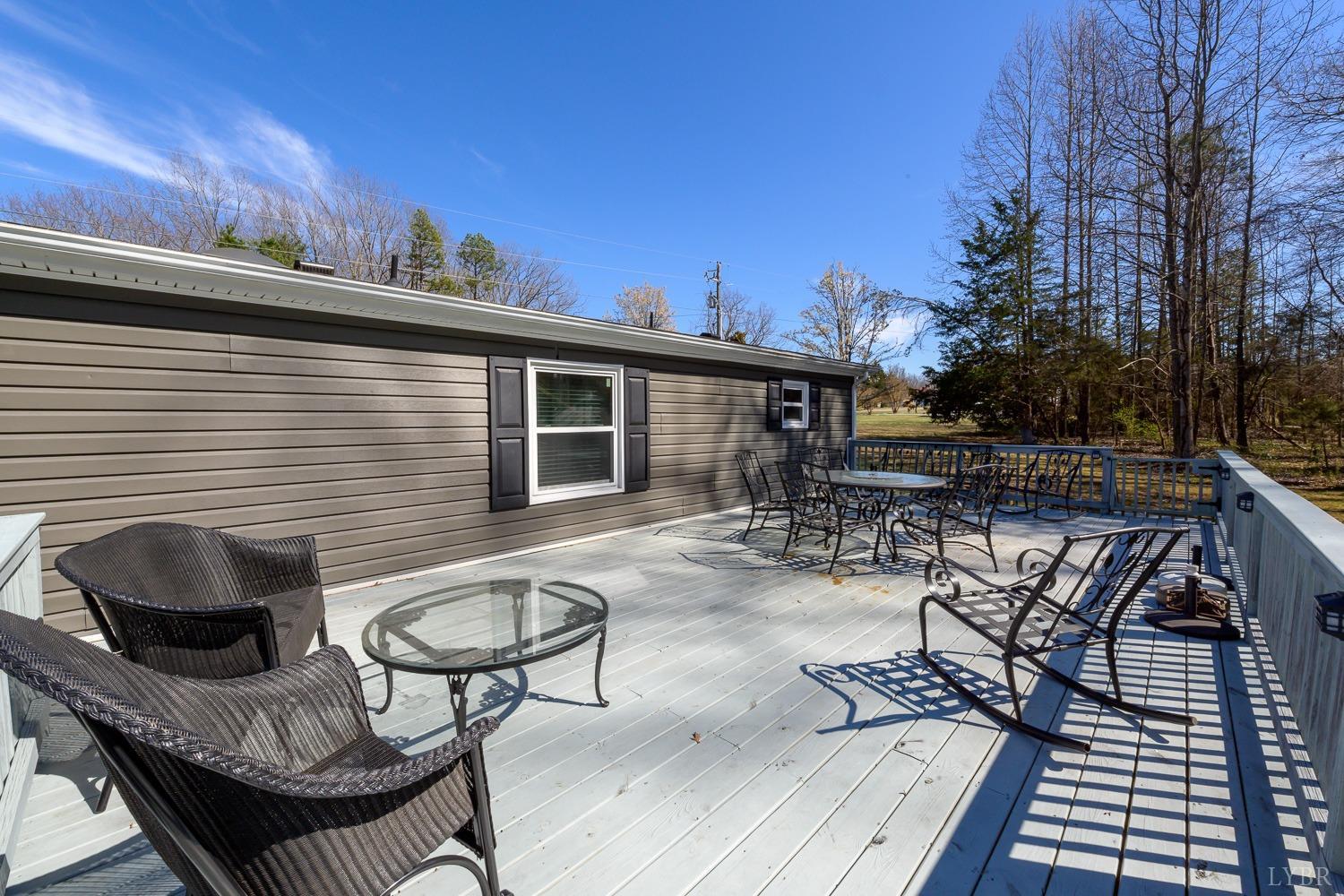 461 Byrd Mill Road Louisa, VA 23093 - Photo 59 of 81 a view of a patio with couches chairs and a potted plant