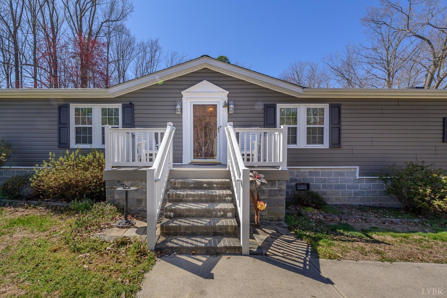 461 Byrd Mill Road Louisa, VA 23093 - Photo 6 of 81 a front view of house with yard and green space