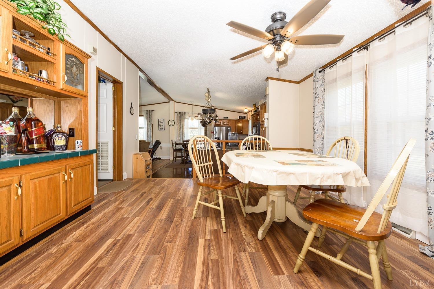 461 Byrd Mill Road Louisa, VA 23093 - Photo 8 of 81 a view of a dining room with furniture and wooden floor