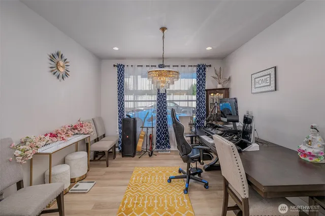 a bathroom with a granite countertop toilet sink and mirror