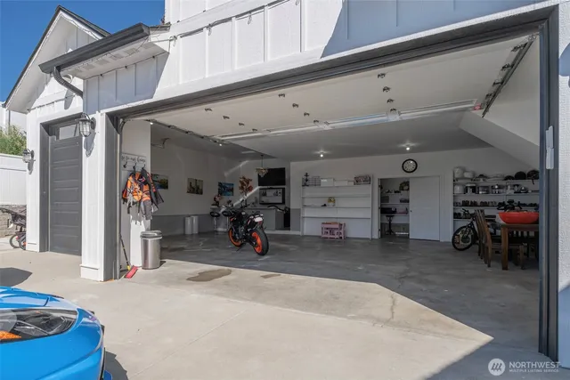 a view of a chairs and table in backyard