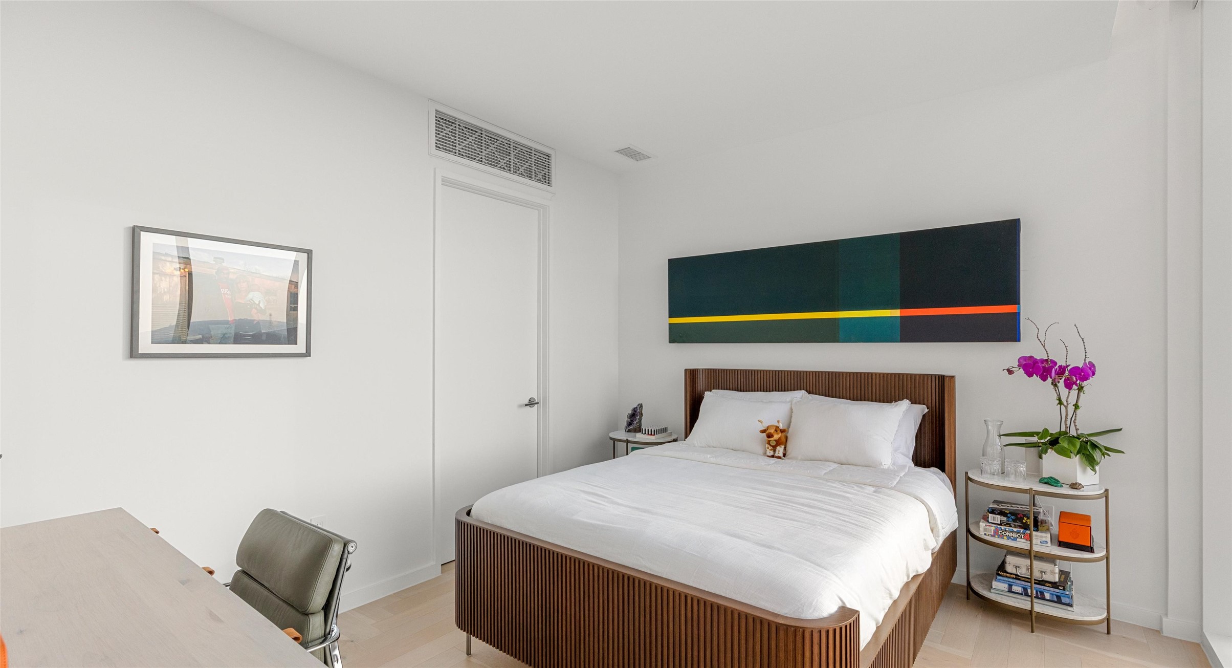 313 West 17th Street, Unit 1104 Austin, TX 78701 - Photo 39 of 40 Bright and versatile second bedroom with floor-to-ceiling windows that capture breathtaking sunsets over the Hill Country. A flexible space that easily transitions into a guest room, home office, or creative retreat.