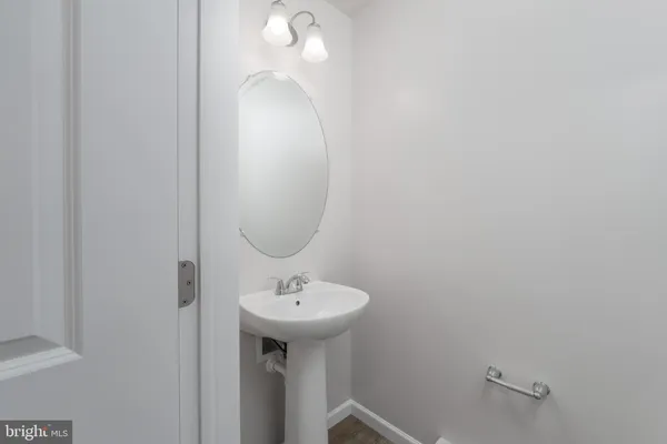 a bathroom with a sink and mirror