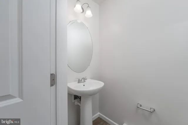 a bathroom with a sink and mirror