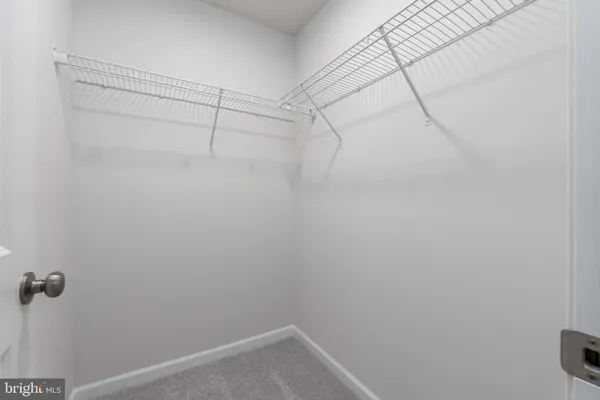 a view of a room with racks on the wall