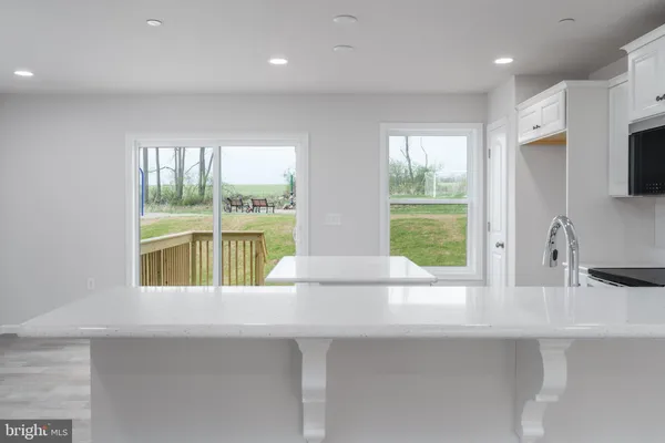 a kitchen with a sink and a large window