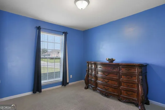 a view of room with flat screen tv