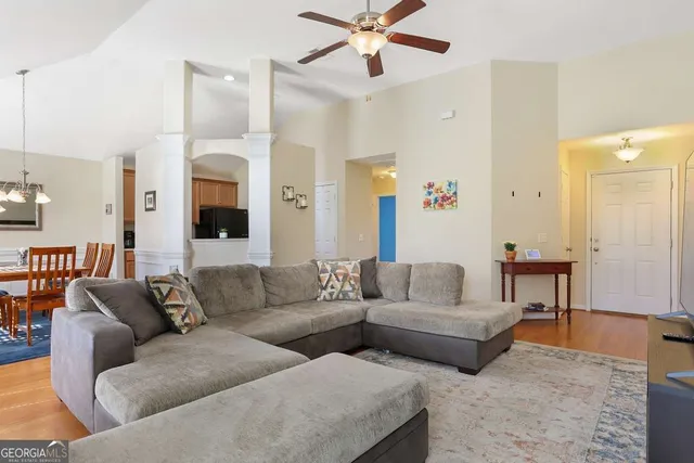a living room with furniture and a large window
