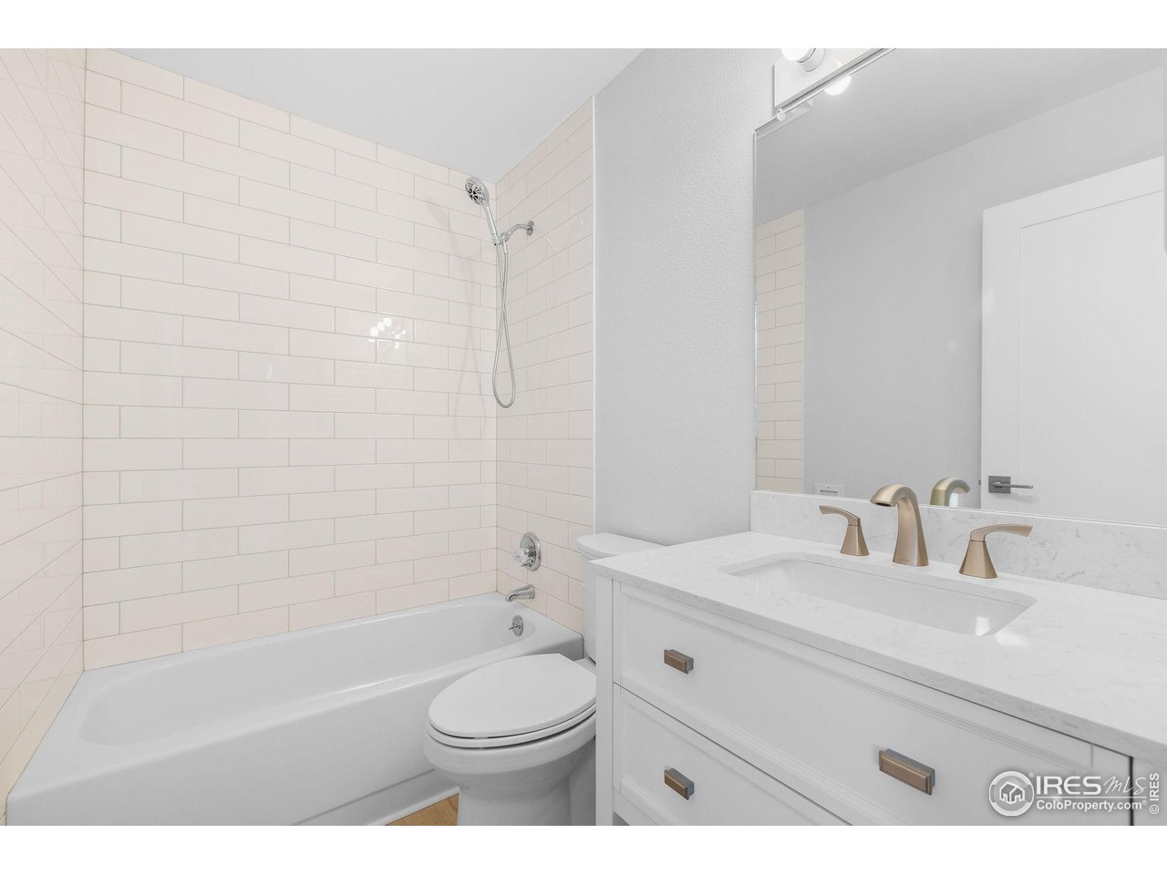 2711 Mapleton Avenue, Unit 9 Boulder, CO 80304 - Photo 12 of 21 a bathroom with a sink a toilet and shower