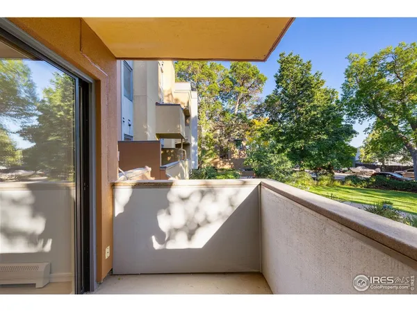 a view of a floor to ceiling window and an outdoor view