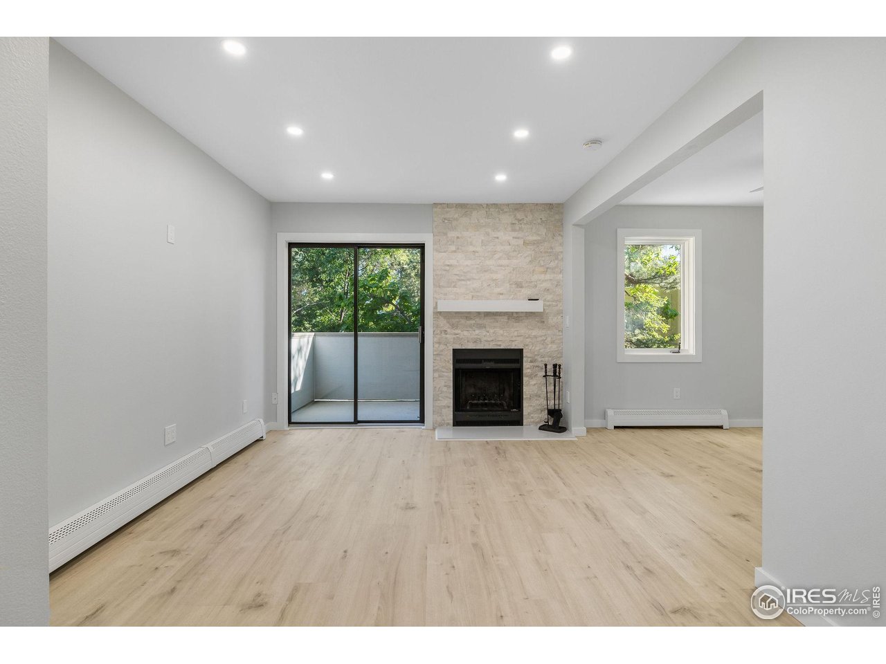 2711 Mapleton Avenue, Unit 9 Boulder, CO 80304 - Photo 6 of 21 a view of empty room with a fireplace
