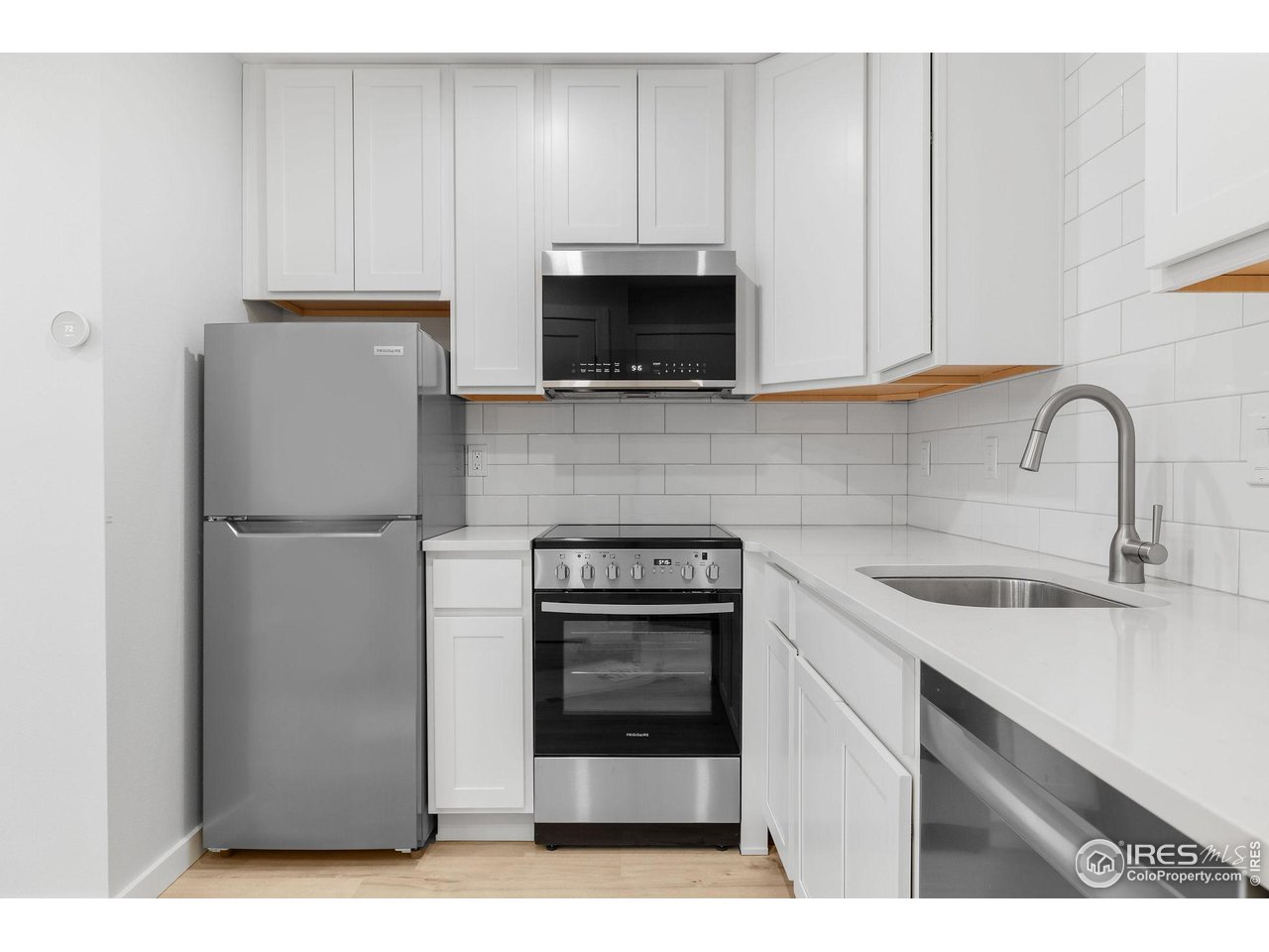 2711 Mapleton Avenue, Unit 9 Boulder, CO 80304 - Photo 8 of 21 a kitchen with a refrigerator sink and cabinets