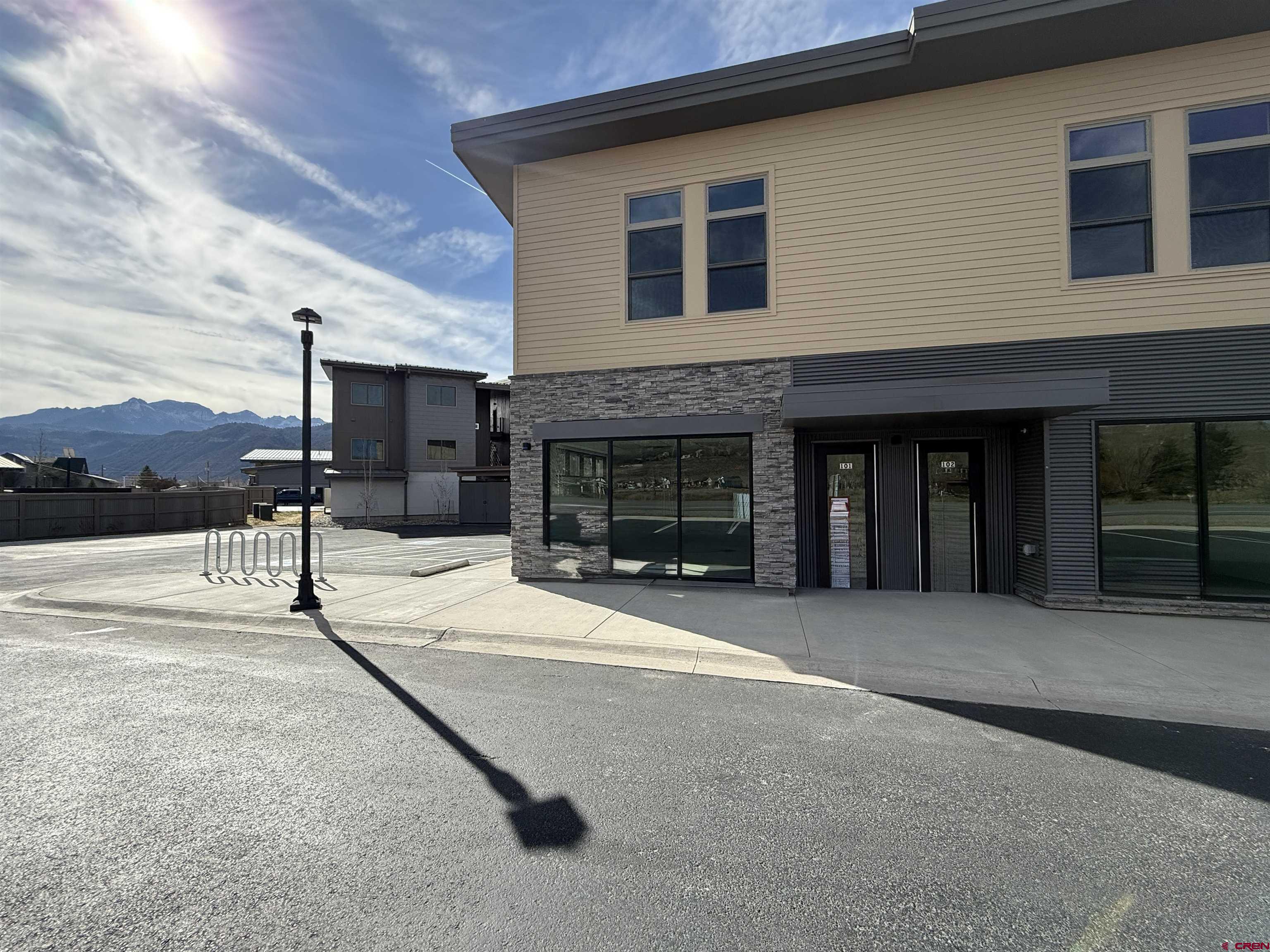 a front view of a house with yard and garage
