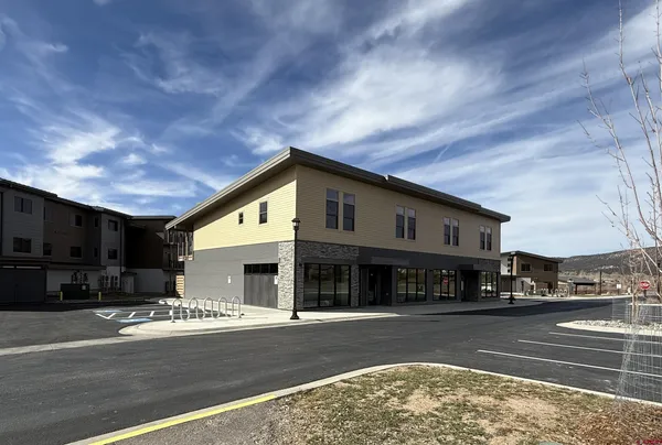 a view of a food mall next to a road