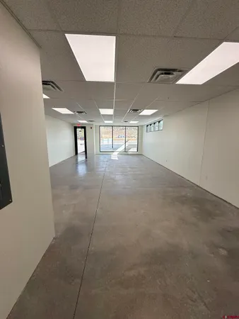 a view of a room with floor to ceiling windows