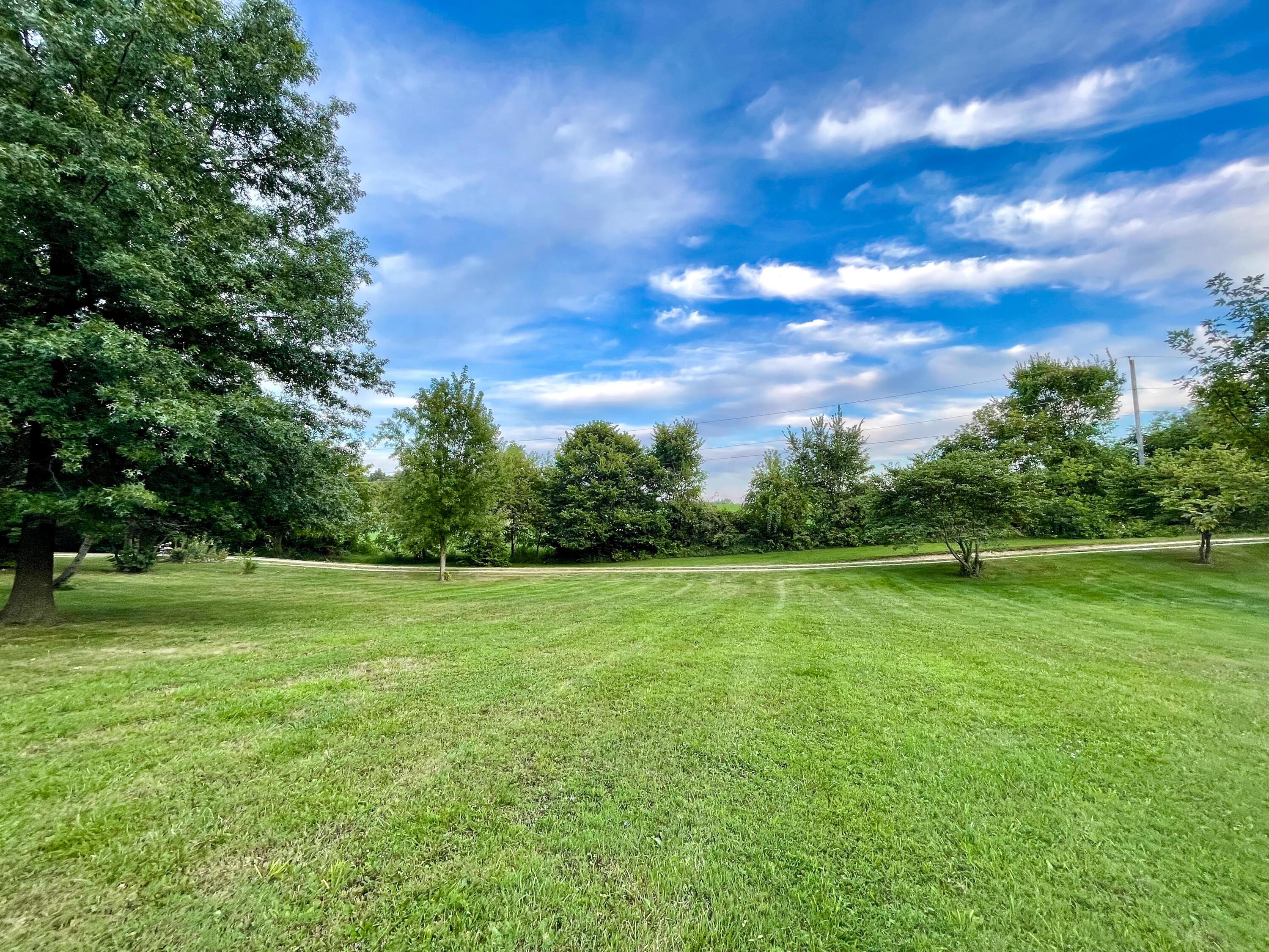 10671 Co Road East Liberty, OH 43319 - Photo 8 of 37 Gently rolling front yard with plenty of open space