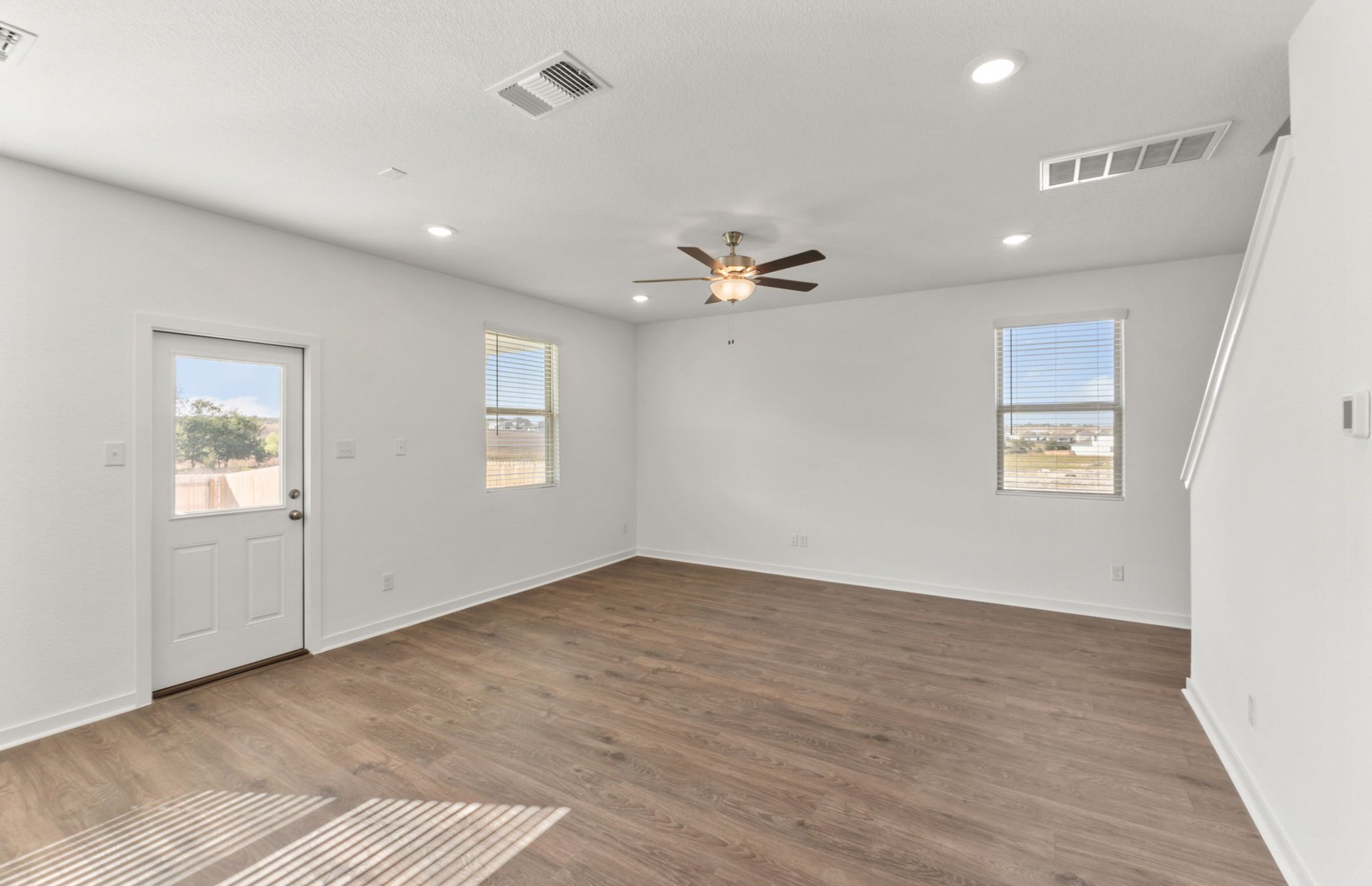 590 Rubber Tree Way Buda, TX 78610 - Photo 7 of 22 a view of an empty room with a window