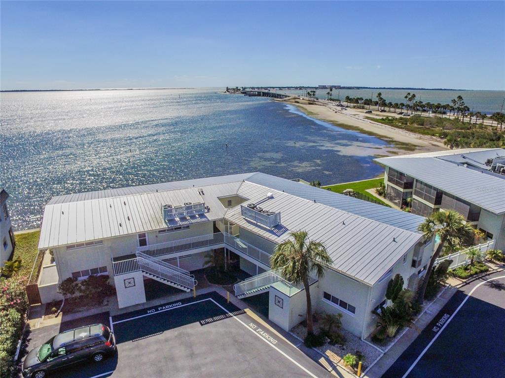 2570 Gary Circle, Unit 4 Dunedin, FL 34698 - Photo 1 of 20 an aerial view of a house with ocean view