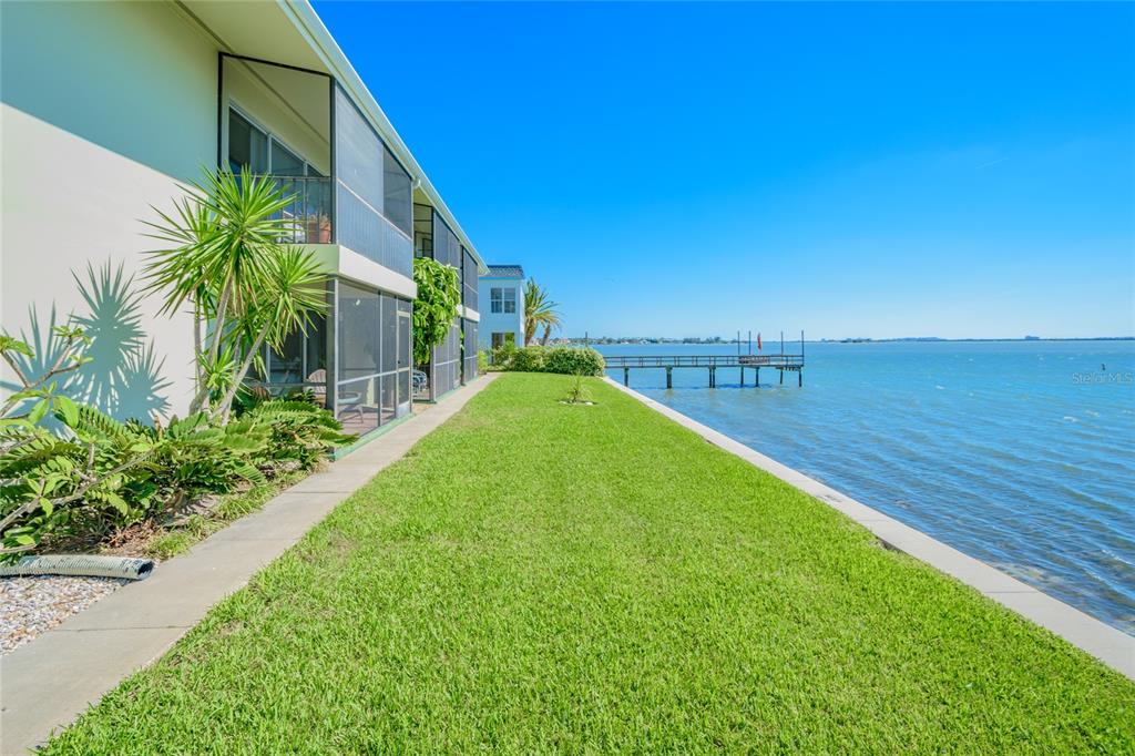 2570 Gary Circle, Unit 4 Dunedin, FL 34698 - Photo 14 of 20 a view of a garden with an ocean