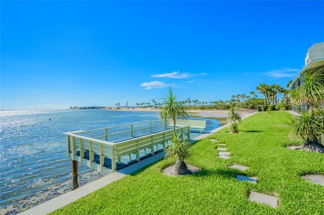 a view of a terrace with wooden floor and fence