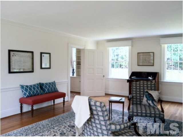 338 Tenney Circle Chapel Hill, NC 27514 - Photo 6 of 25 Living room with wood burning fireplace adjoins study and 3-season glassed in porch.