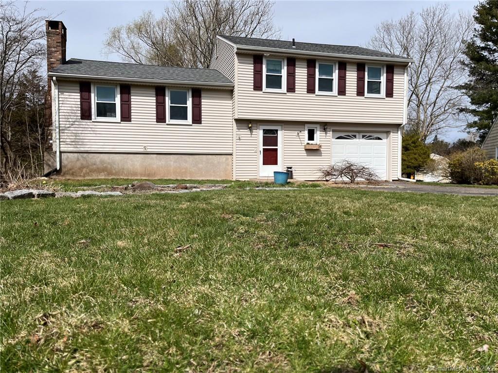 a view of a house with a yard