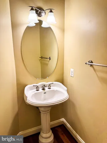 a kitchen with stainless steel appliances granite countertop a stove and a wooden floors